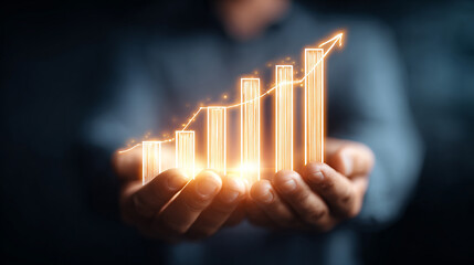 Man holding upward trending chart in hands with glowing effect.