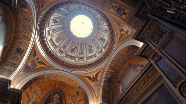 Ornate basilica apse with golden fresco of Virgin Mary and saints surrounded by painted panels and marble architecture