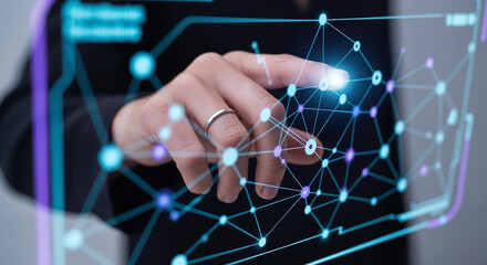 Close-up of a hand with a ring touching a glowing node on a futuristic data network interface