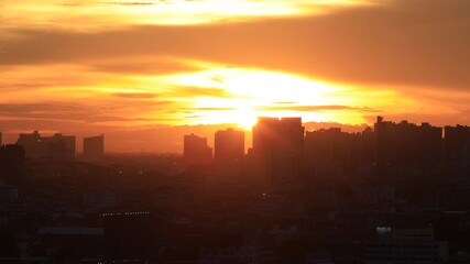 Video background of a fast-moving sky during the evening to dusk, amidst apartment buildings, houses in a community, the distribution of lights, lighting technology.