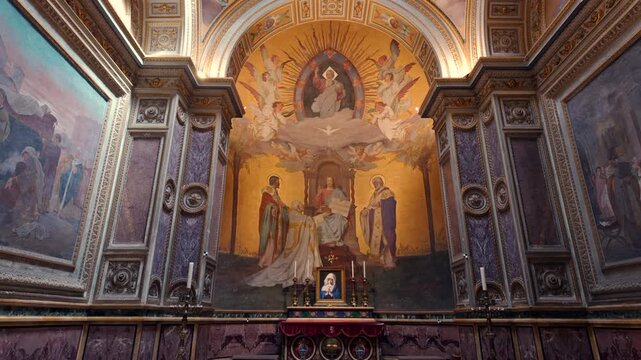 Dome and apse of basilica with angel frescoes, golden interior details and circular window illuminating sacred space