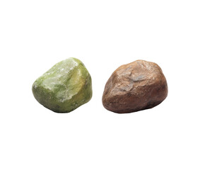 Two smooth, rounded stones, one light green, one light brown, isolated on black background