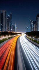 Obraz premium Elevated Highway at Night with Light Streaks and City Skyline