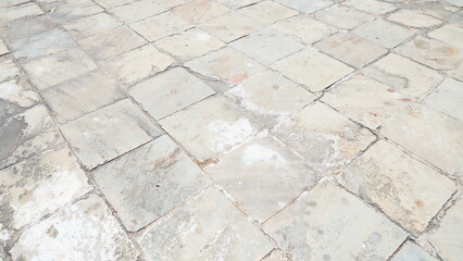 Old weathered stone tiles texture with natural pattern and cracks