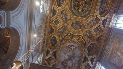 Golden coffered ceiling with religious frescoes and ornate reliefs in historic basilica with classical column and elaborate decoration - Powered by Adobe
