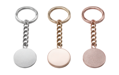 Three round keychains, in silver, rose gold, and brushed gold tones, display a simple design with a circular metal disc and a looped chain