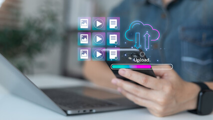 Person using smartphone and laptop with cloud upload icon, file transfer interface, and progress...