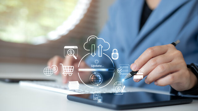 Businesswoman using tablet and keyboard with cloud data update interface and digital business icons, concept of online storage, fintech, and secure cloud computing