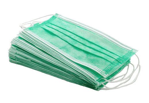Stack of mint-green disposable face masks