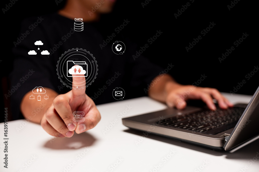 Poster person using laptop with virtual data icons, emphasizing digital file transfer.