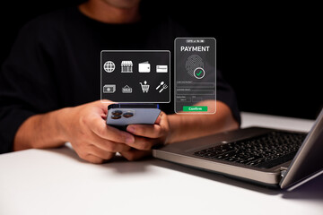 Person using a smartphone with digital payment interface near a laptop, symbolizing online shopping and mobile transactions.