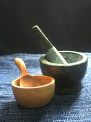 mortar and pestle on wooden table, closeup