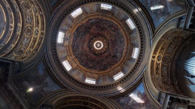 Baroque dome of Sant&rsquo;Agnese in Agone seen from directly below with vivid frescoes and intricate architectural details