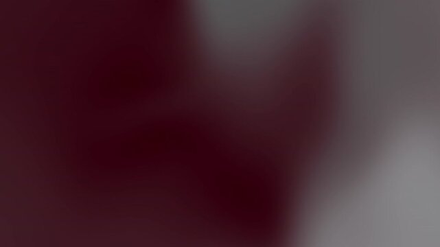 gradient featuring dark red and gray hues. Suitable for backgrounds, design projects, web graphics, and digital art.