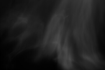 Blur white water vapour on isolated black background. Abstract of steam with copy space. Steam flow. Smoke on white background.