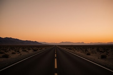 Vanishing road in the desert at sunset, somewhere in USA