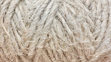natural beige hemp rope fiber close up macro texture for craft packaging and rustic home decoration projects

