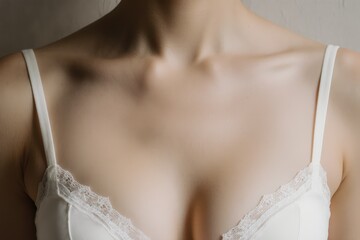 close full framed view of a deep neckline's woman with big breast wearing fine sexy white lingerie