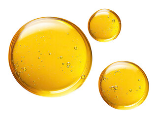 Three translucent, golden-yellow liquid droplets, close-up.  Bubbles are visible within the liquid