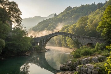 Wide-Angle Landscape Photography of Ancient Stone Bridge Over Misty River