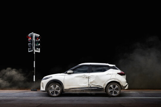 Car crash accident with traffic light – SUV collision caused by drowsy or distracted driving at night - Powered by Adobe