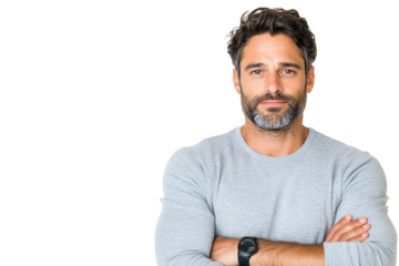 Confident man in casual attire with arms crossed, looking at the camera against a white background.