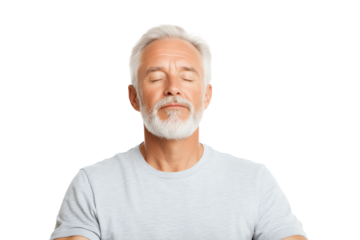 Senior man meditating with eyes closed, peaceful expression, white isolated background.