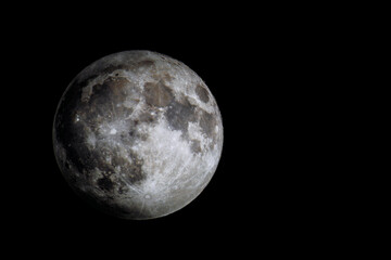 Full Moon with sharp craters and surface detail against black space