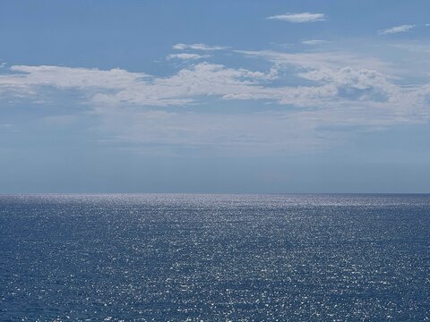 Sea glittering beautiful water and blue sky.