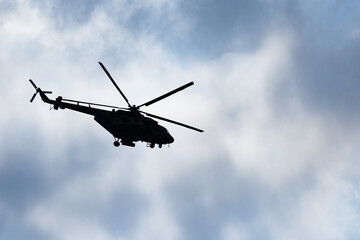 Silhouette of Mi-17 helicopter against the sky
