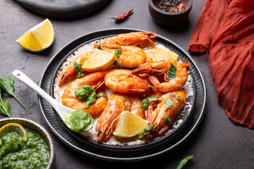  Fried shrimps with lemon and green in a plate