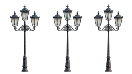 Three ornate lampposts with multiple heads, standing in a row, isolated on a white background.