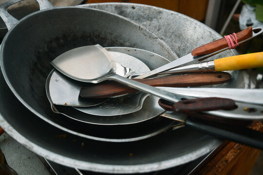 cauldron, spatula and traditional cooking utensils in the kitchen