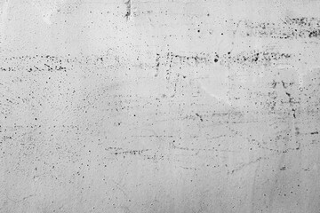 A textured, distressed wall with subtle imperfections and faint markings, perfect for adding a raw, industrial aesthetic to design projects.