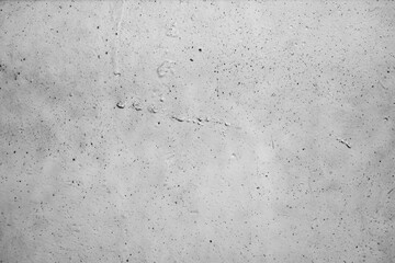 A textured, distressed wall with subtle imperfections and faint markings, perfect for adding a raw,...