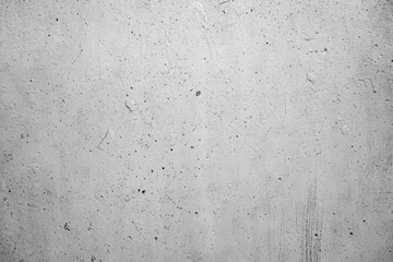 A textured, distressed wall with subtle imperfections and faint markings, perfect for adding a raw,...