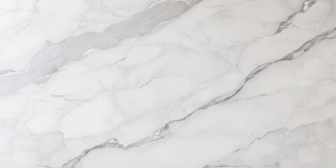 Luxury texture of light gray marble with flowing natural patterns and faint metallic highlights.	