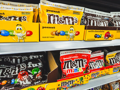 Minneapolis, USA - August 9, 2025: Mars company M&M's chocolate candies, featuring classic options like Peanut and Milk Chocolate, alongside Peanut Butter and M&M's Minis. Editorial Use Only.