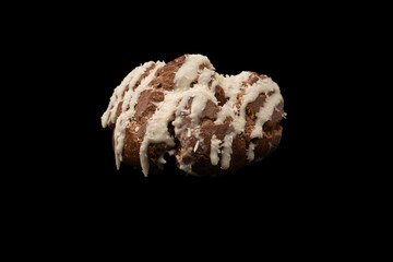 Profiteroles with coconut cream on a black background.