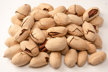 Pecan-nut in a shell isolated on white background. Top view.
