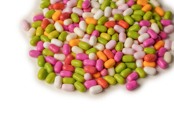 Sweet multicolored candies isolated on white background.