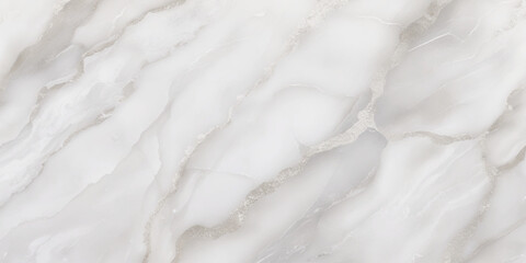 Luxury texture of light gray marble with flowing natural patterns and faint metallic highlights.