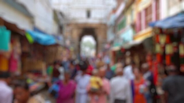Bokeh view of devotees visit Sri Govinda Raja Swamy Temple in Tirupati, India. Blurred background footage.