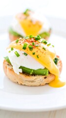 Poached egg sandwich with avocado and hollandaise sauce.