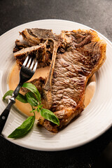 t-bone steak roast cut of meat juicy roast beef tasty snack fresh delicious gourmet food background on the table rustic food top view copy space