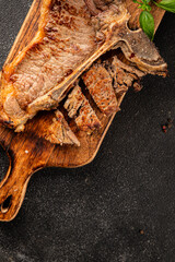 t-bone steak roast cut of meat juicy roast beef tasty snack fresh delicious gourmet food background on the table rustic food top view copy space