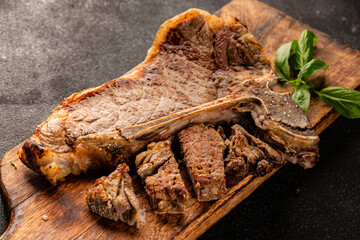 t-bone steak roast cut of meat juicy roast beef tasty snack fresh delicious gourmet food background...