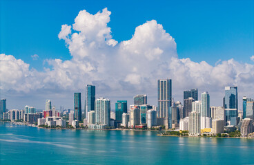 Naklejka premium Famous landmarks of Miami Brickell from above. Drone view of the Brickell in Miami city. Business in Brickell district. Biscayne Bay Florida iconic urban coastline in daylight.
