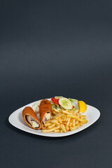 A savory rolled pancake filled with a chicken, cheese and spinach, served alongside a fresh salad...