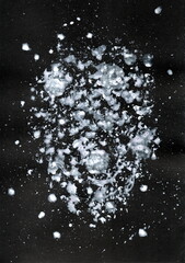 An abstract composition reminiscent of the night starry sky or a cosmic nebula. Light spots and splashes of white of varying intensity are scattered on a black background.